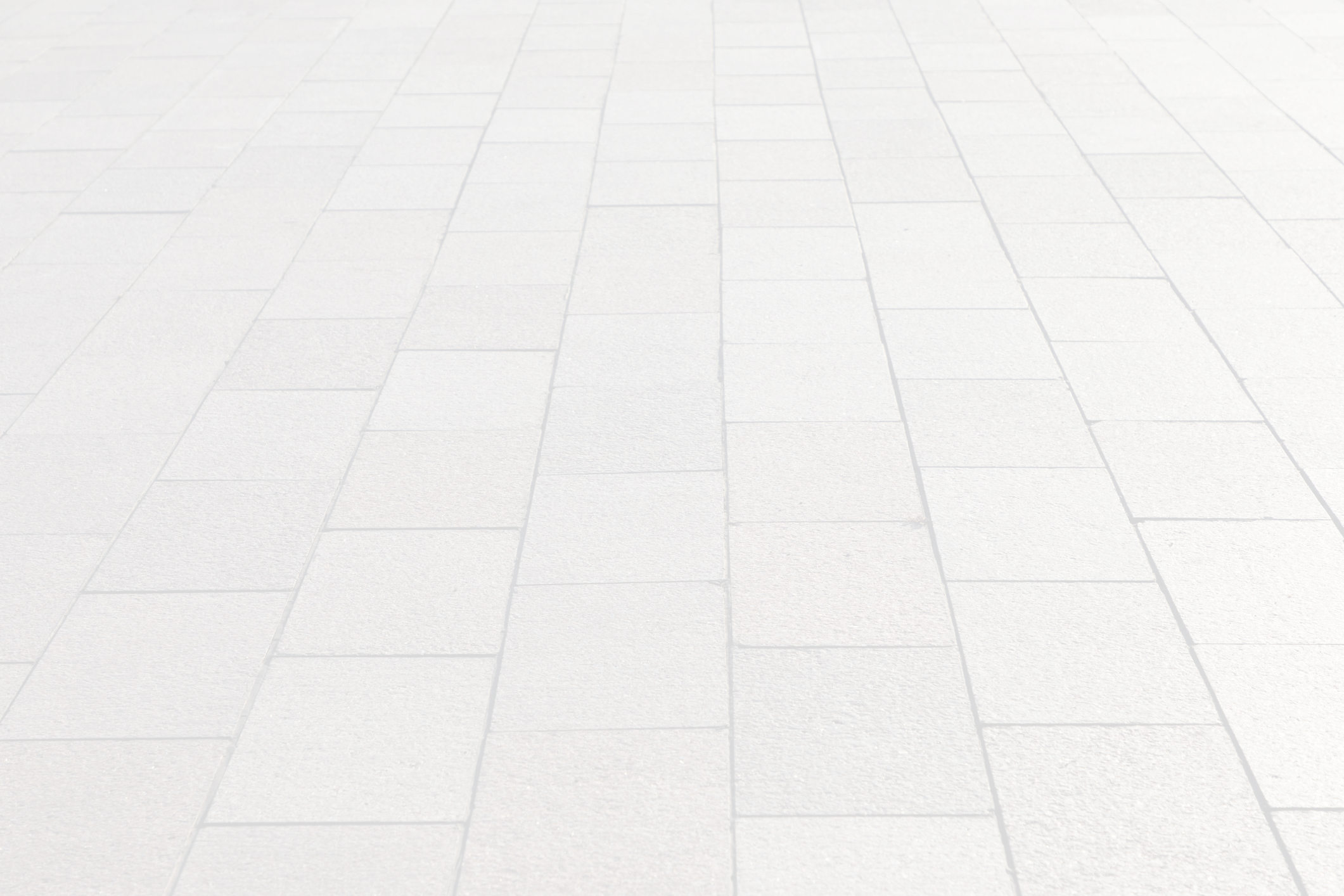 Light gray rectangular stone pavement in perspective