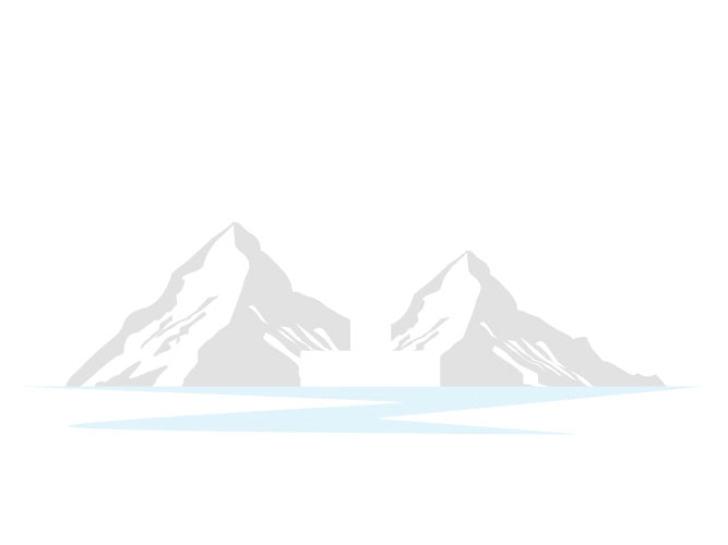 Gray mountain silhouettes above pale blue water
