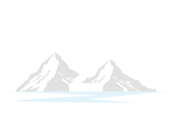 Gray snowcapped mountains above pale blue water