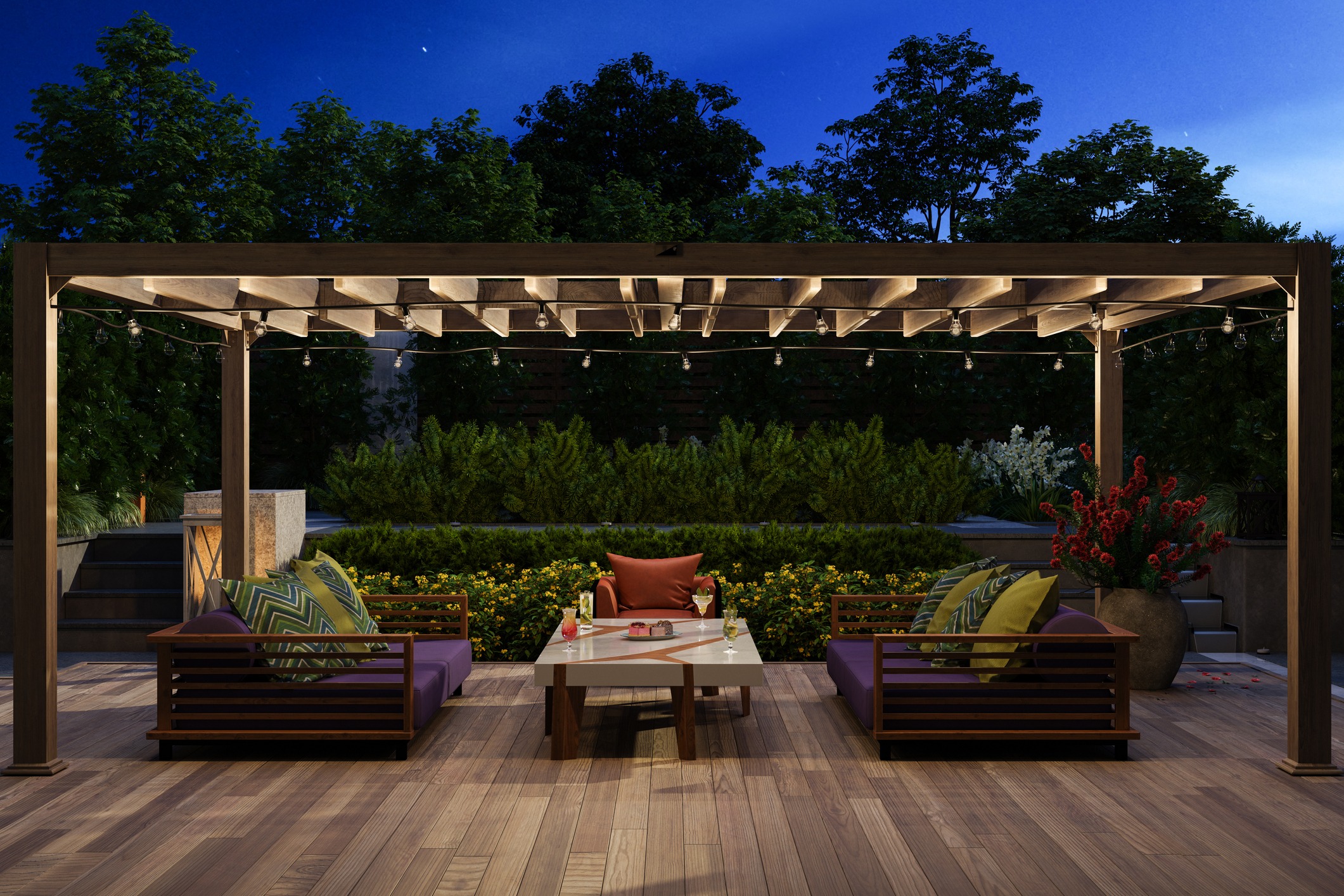 Pergola lounge with sofas, drinks, and string lights at dusk