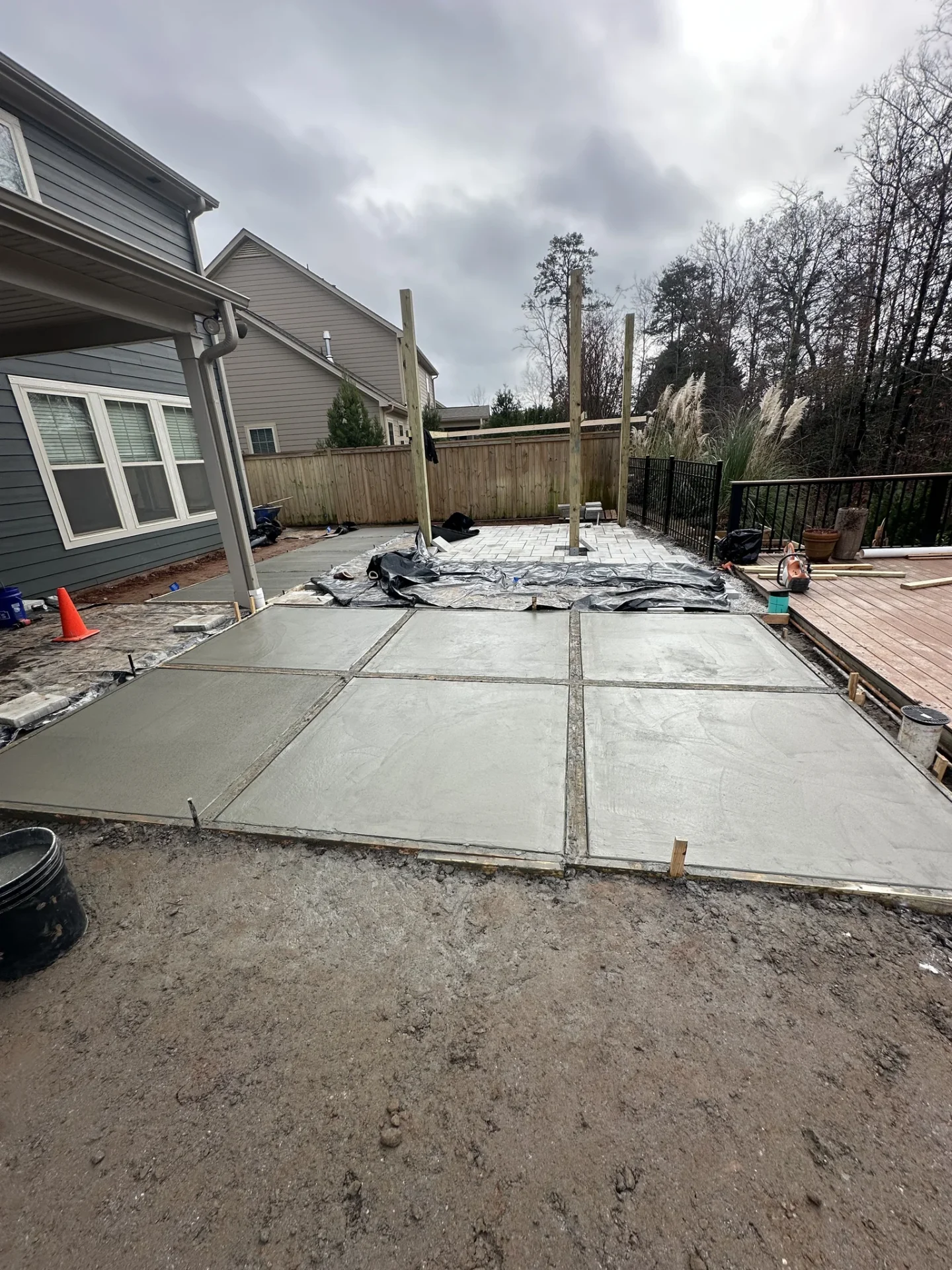 New concrete patio slabs installed in a backyard